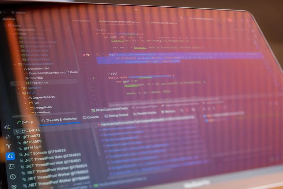 A modern computer screen displaying web design work, showcasing creative visuals in a workspace.
